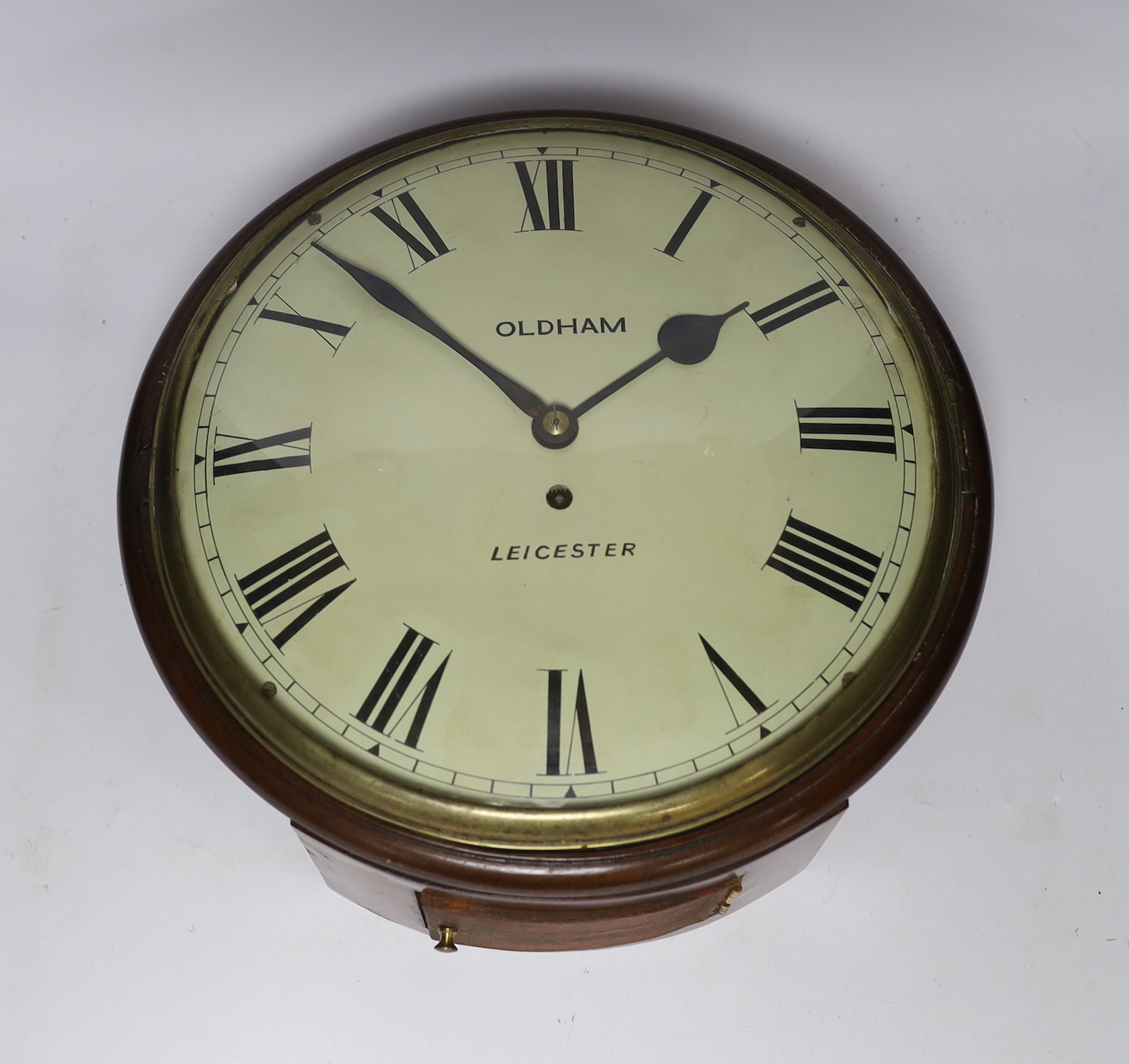 A mid 19th century mahogany dial clock, inscribed ‘Oldham, Leicester’, with key and pendulum, 36cm